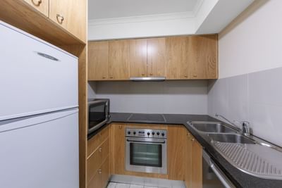 Kitchen in 1 Bedroom with Office at Nesuto Canberra Apartment