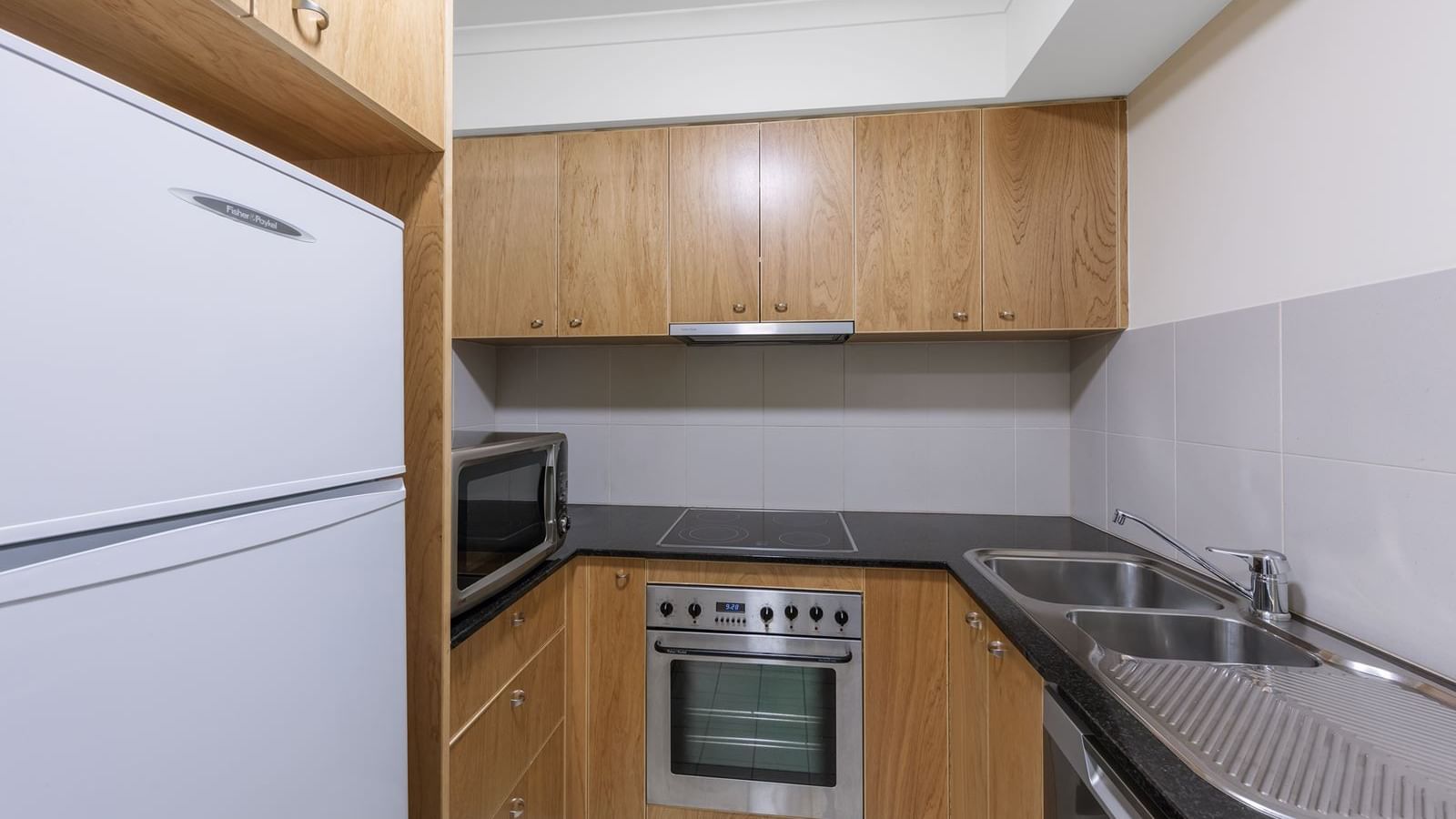 Kitchen in 1 Bedroom with Office at Nesuto Canberra Apartment