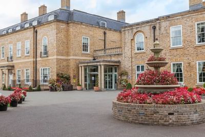 Exterior view with flower fountain at Orsett Hall Hotel