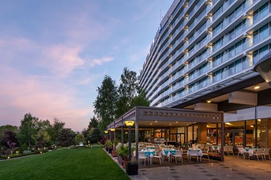Exterior view of Ana Hotels Europa with Terrace dining area & green lawn