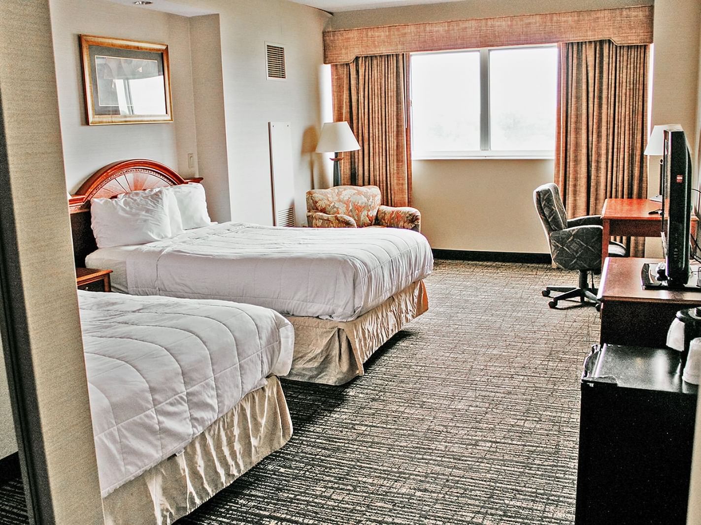 Our Accessible Double Guest Room is spacious and equipped with two full size beds, standard amenities, and a refrigerator.