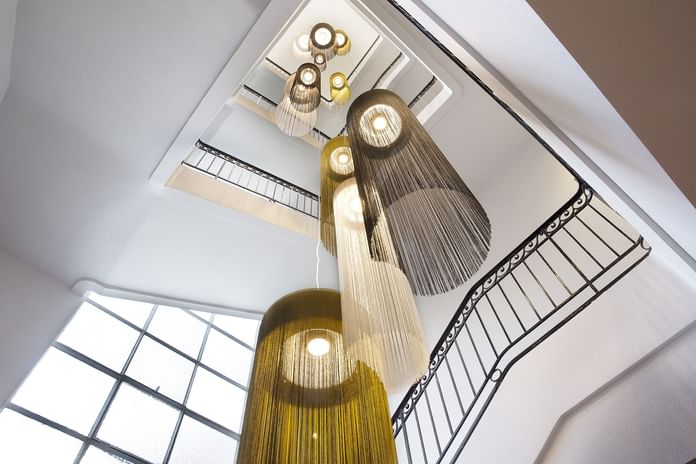 Low-angle shot of hanging lights at Oceania Hotels