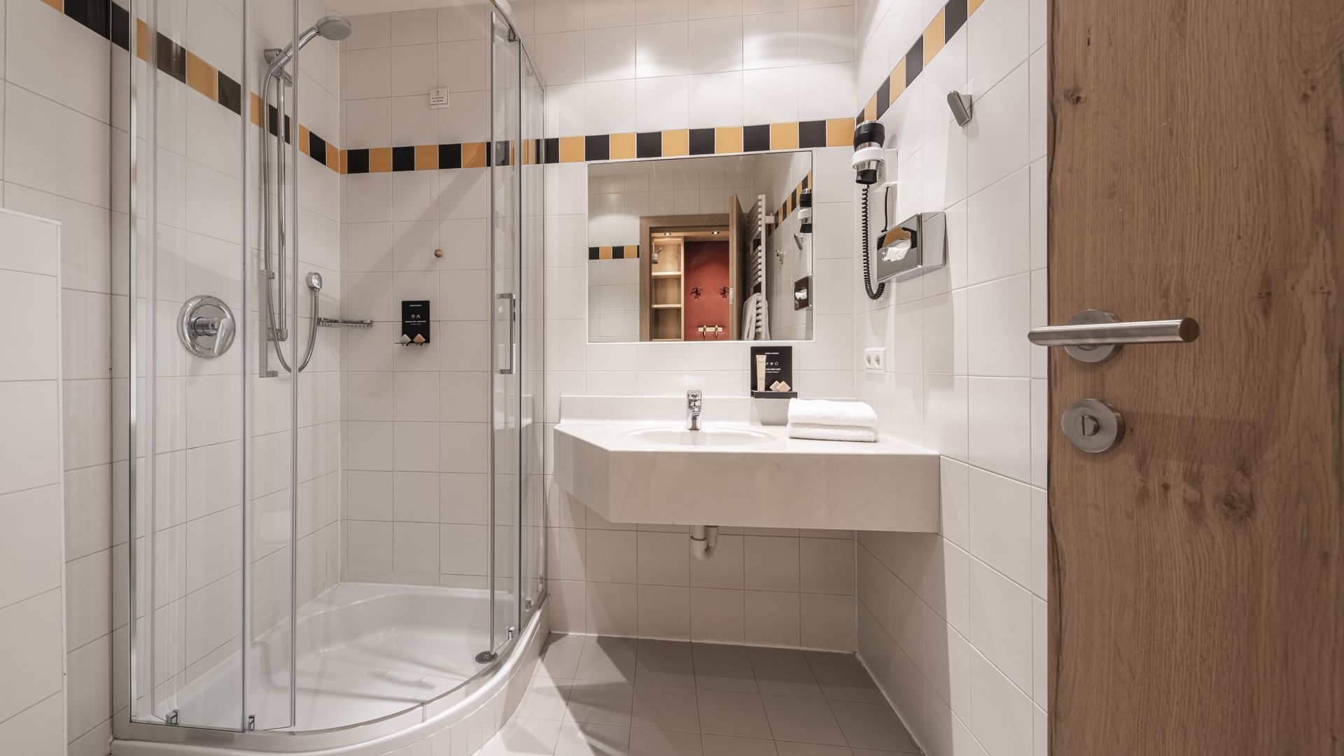 Shower & vanity area in Smart Baby Room at Falkensteiner Hotels