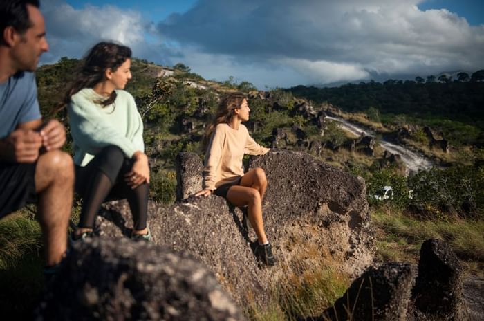 Group of friends overlooking the mountains from a view point near Hotel Rio Perdido