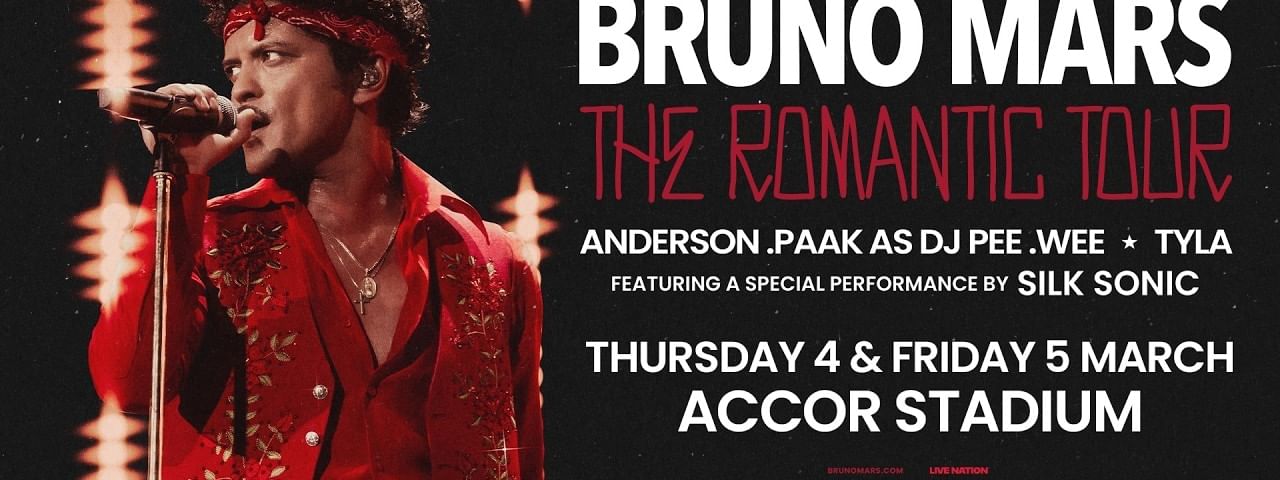 Bruno Mars performing on stage in a red embroidered jacket during The Romantic Tour 2027 at Accor Stadium in March