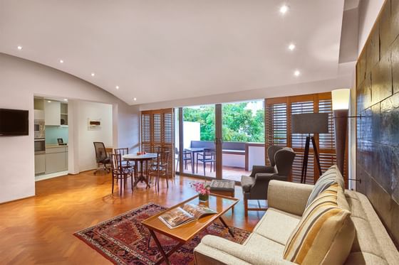 Parklane Split-Level Studio living room with balcony terrace, sitting area and TV at Goodwood Park Hotel