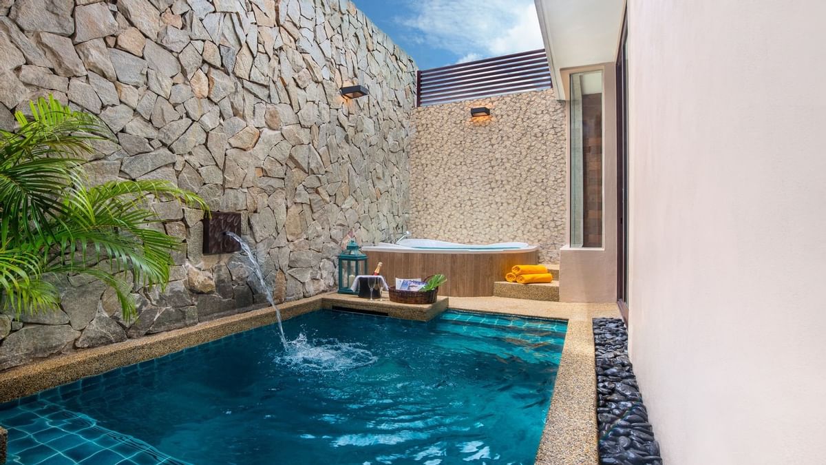 Private plunge pool with stone walls and hot tub in Lake Villa at The Banjaran Hotsprings Retreat, Ipoh.