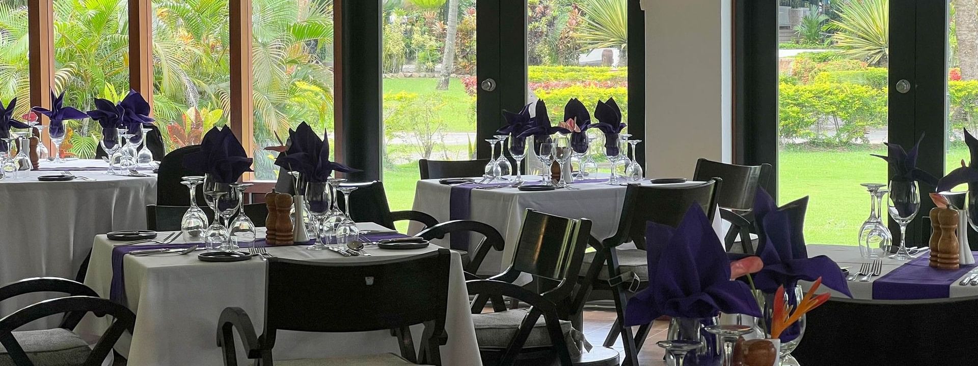 Dining area with set tables at Talei Restaurant of The Naviti Resort in Korolevu