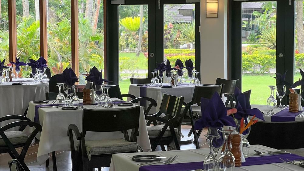 Dining area with set tables at Talei Restaurant of The Naviti Resort in Korolevu.