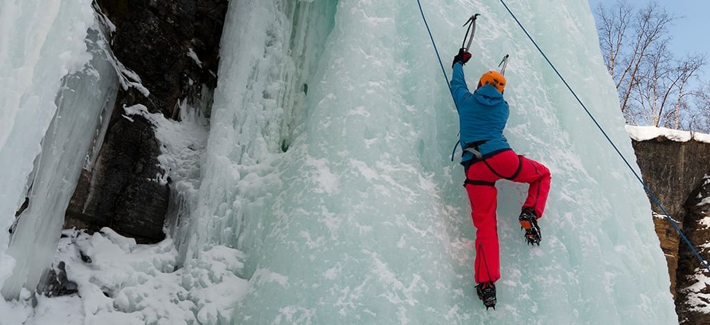 ice climbing on a frozen waterfall