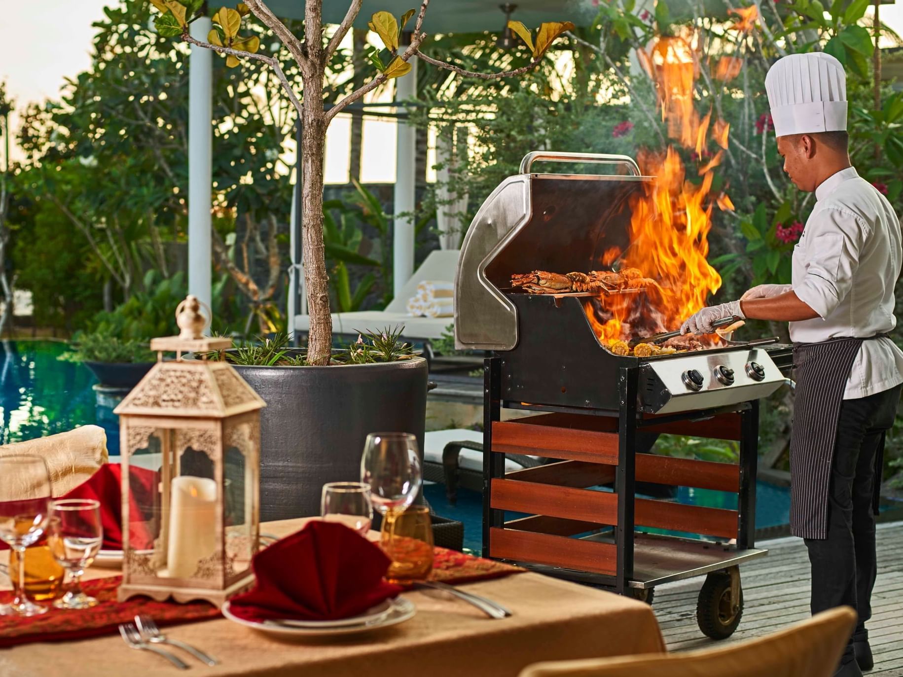 Chef using an outdoor BBQ grill at Danna Langkawi Hotel