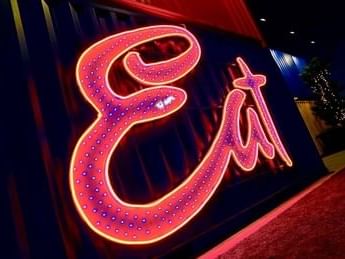 Neon signboard of Eat Street Northshore in Queensland near Alcyone Hotel Residences