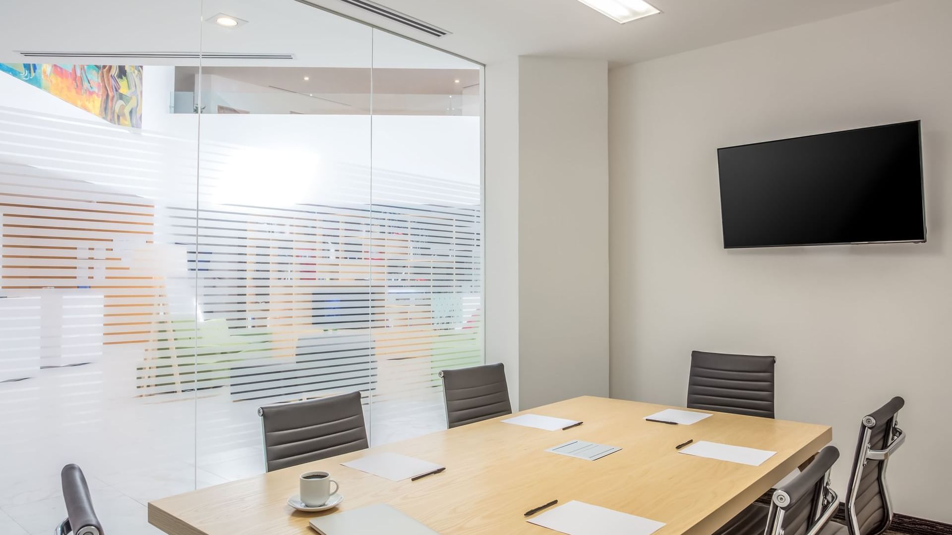 Conference table setup in a meeting room at F I Monterrey La Fe