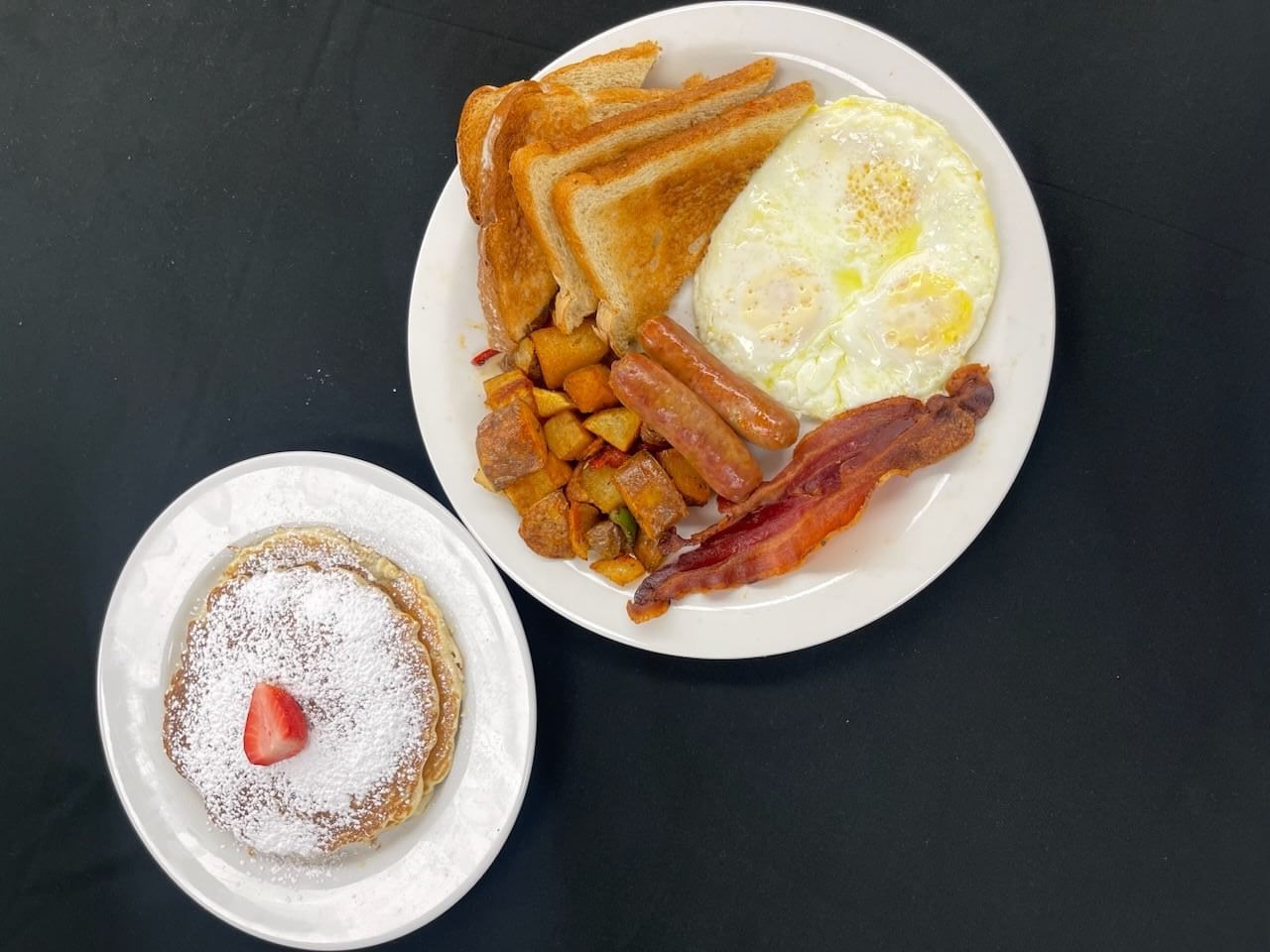 Top view of an English breakfast meal served with pancakes at Alexis Park Resort