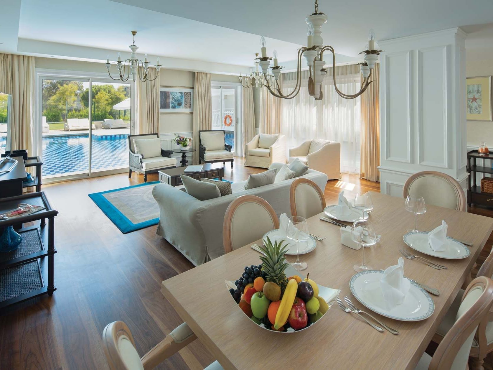 Dining area & living area in Superior Villa with wooden floors at Titanic Deluxe Golf Belek