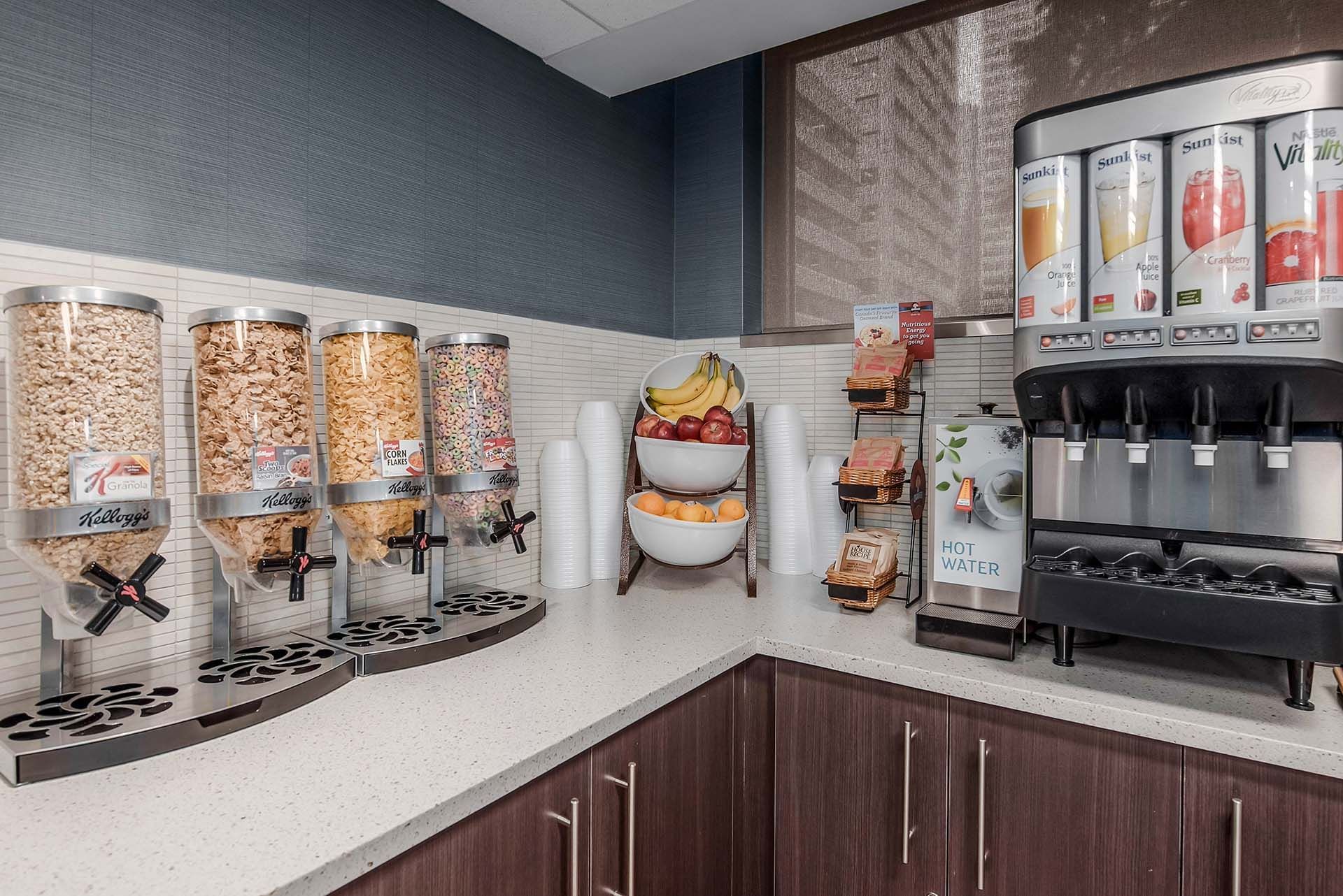 Selection of cereal, fruit and juices in the breakfast room