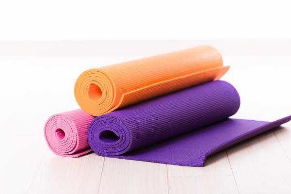 Stacked matts ready for group Pilates class