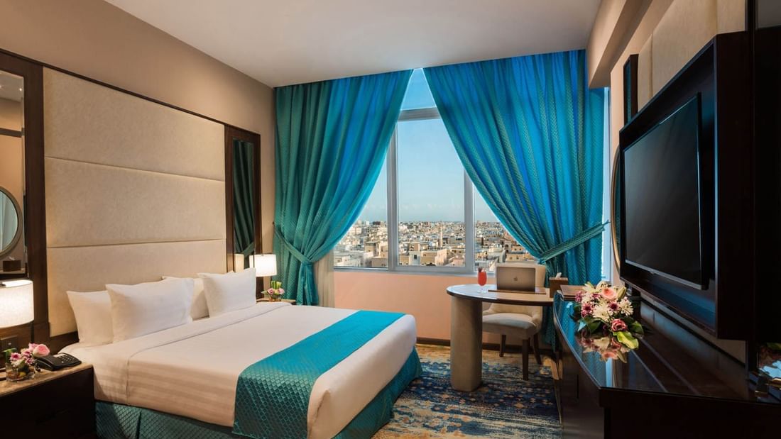 Interior of Junior Suite with city view at Naviti By Warwick Dammam
