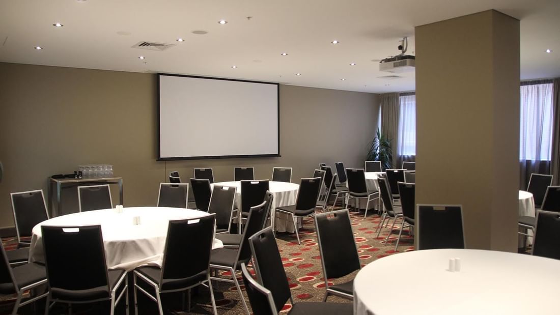 Banquet table set-up in Albert Room with carpeted floors at Pullman Albert Park