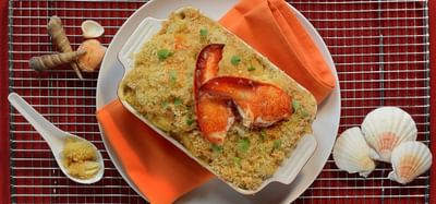 Photo of lobster mac and cheese aside ornamental seashells
