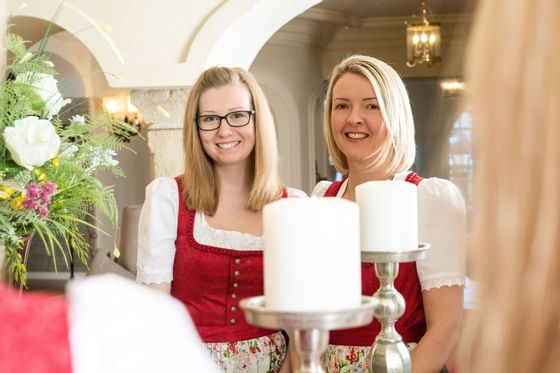 Two ladies of the reservation staff posing at Liebes Rot Flueh