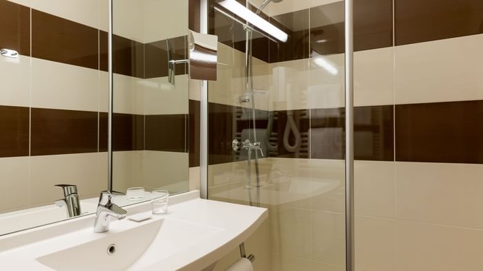Bathroom vanity in bedrooms at Hotel Rey du Mont Sion
