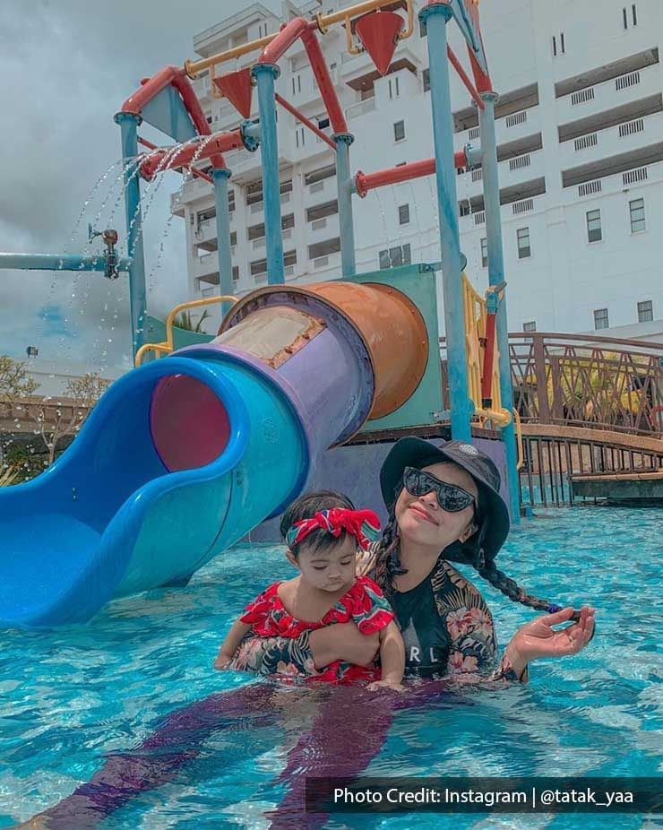 a mother and her kid chilling in a swimming pool at Lexis Port Dickson