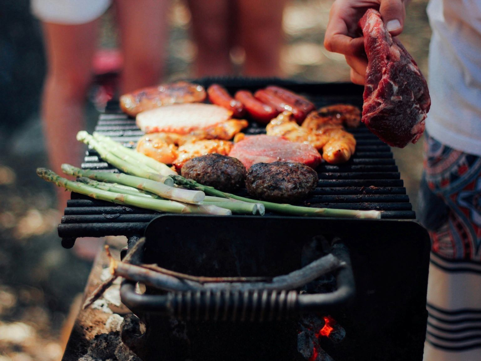 memorial day barbecue with burgers, sausages and chicken on a grill