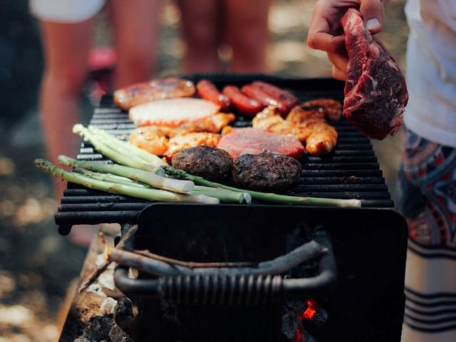 memorial day barbecue with burgers, sausages and chicken on a grill