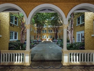 Archway entrance to a garden area at Artmore Hotel