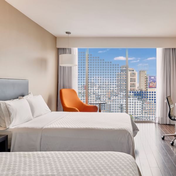 Large Bed, lounge & desk in Executive Double Room at Fiesta Inn