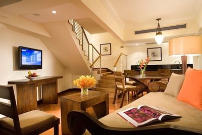 Dining table by TV lounge area in Cabana at York Hotel Singapore