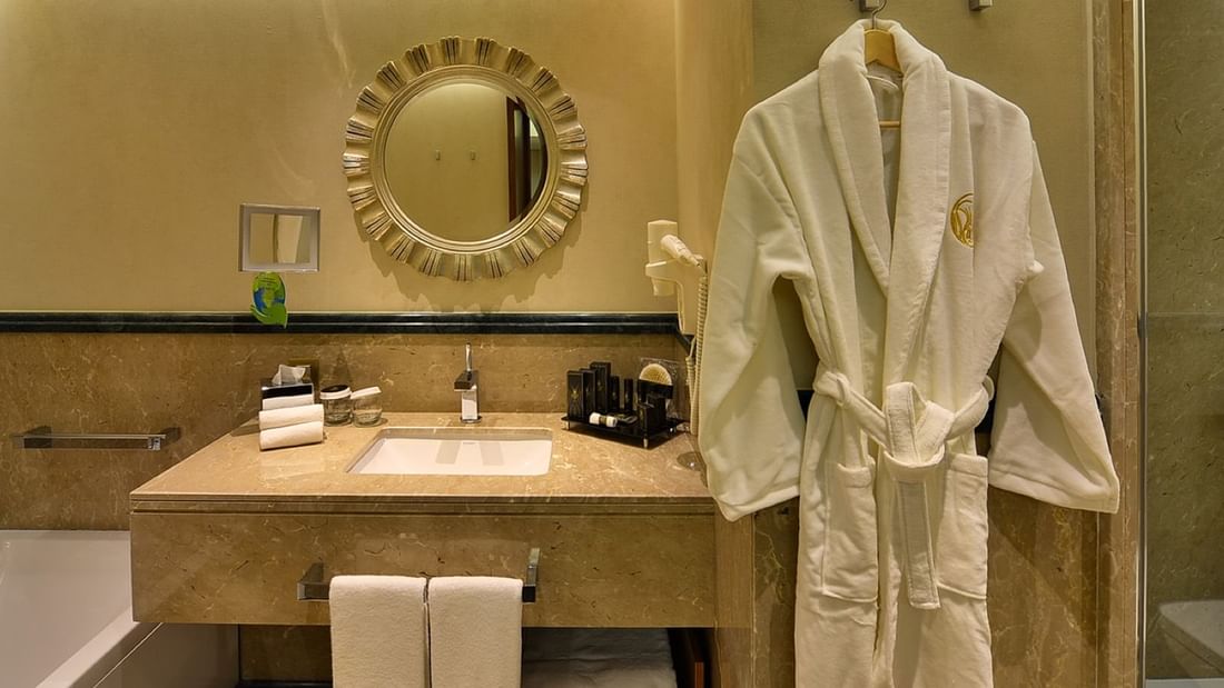 Bathrobe by the bathroom vanity in Warwick Suite with Terrace at Warwick Ankara