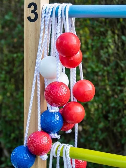 Close-up of ladder balls, hanging from a pole at Cove Pocono Resorts