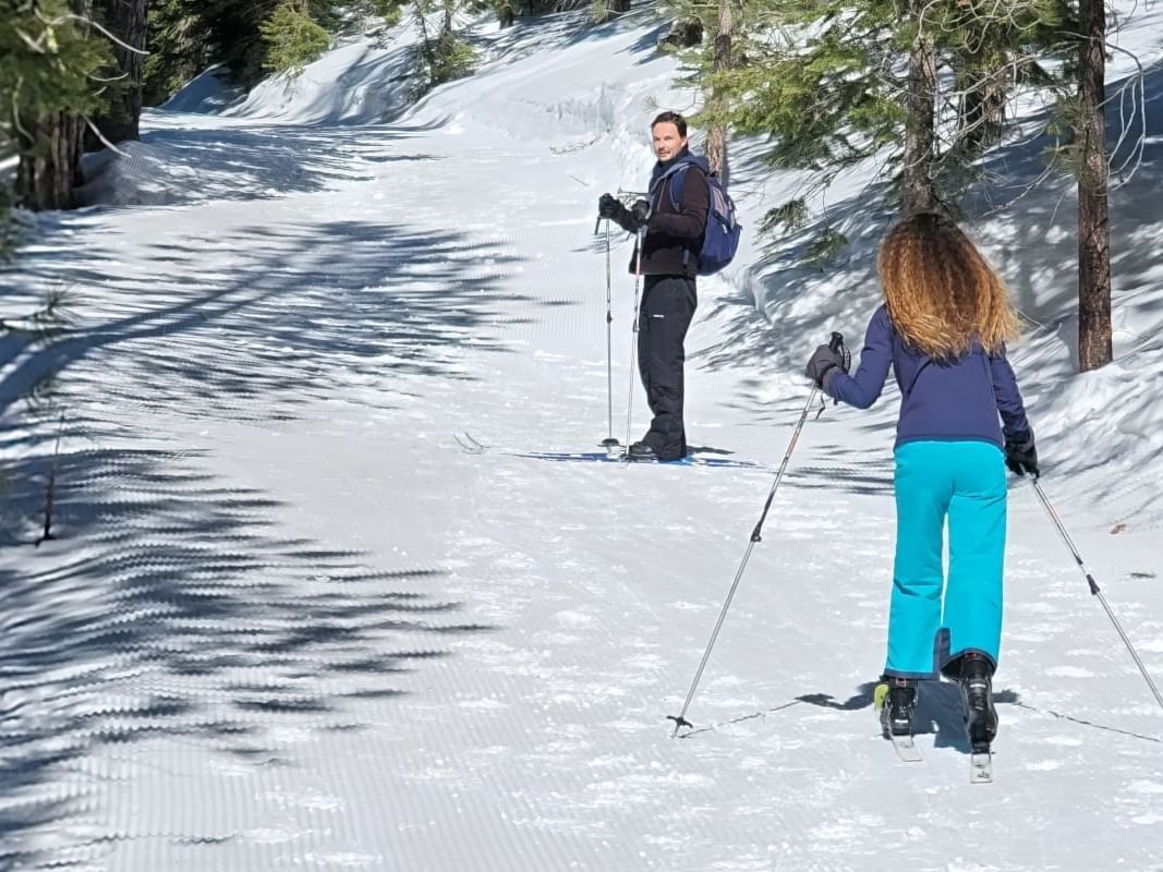 Parent and child enjoying Granlibakken's groomed 1.5 cross-country ski trail