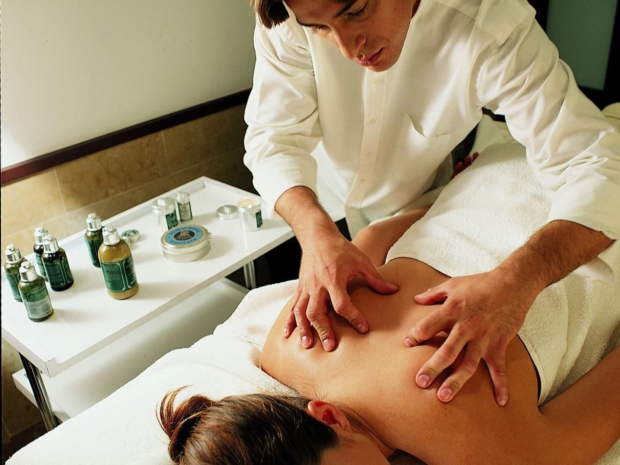 Lady getting body massages from spa at Grand Fiesta Americana