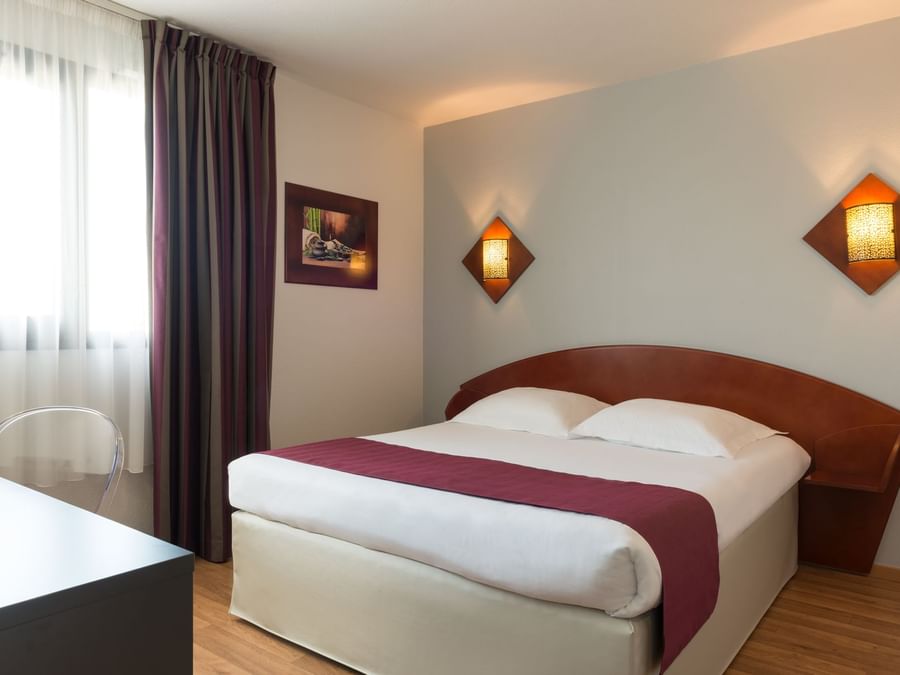 View of bed in Standard double room at The Originals Hotels