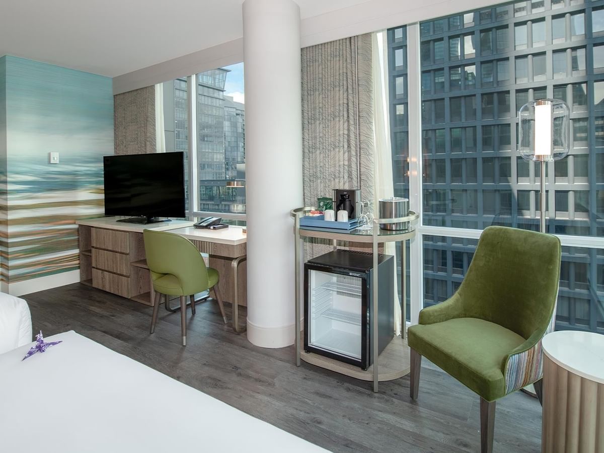 Interior of Coast Two Queens Corner Room with city view.