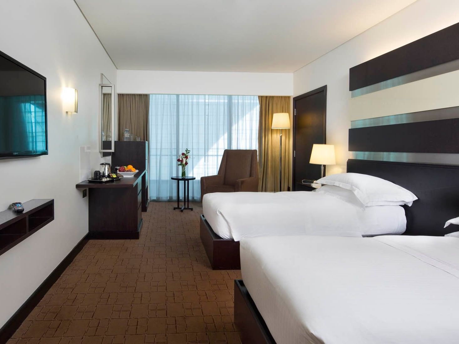 Double beds in Deluxe Room at Dubai International Hotel