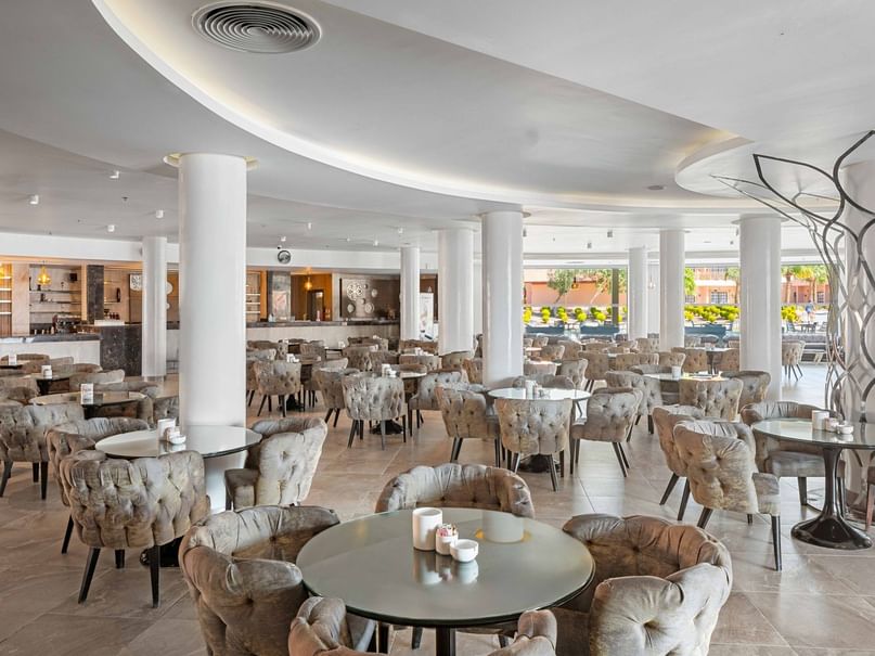 Elegant dining area with tables and chairs at Jungle Bar, Pickalbatros Alf Leila Wa Leila Resort - Neverland Hurghada.