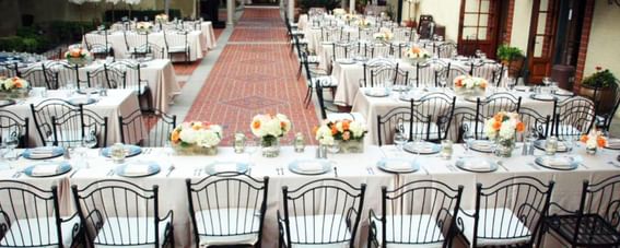 Tables arranged for an event in a Hall at Catalina Island Company