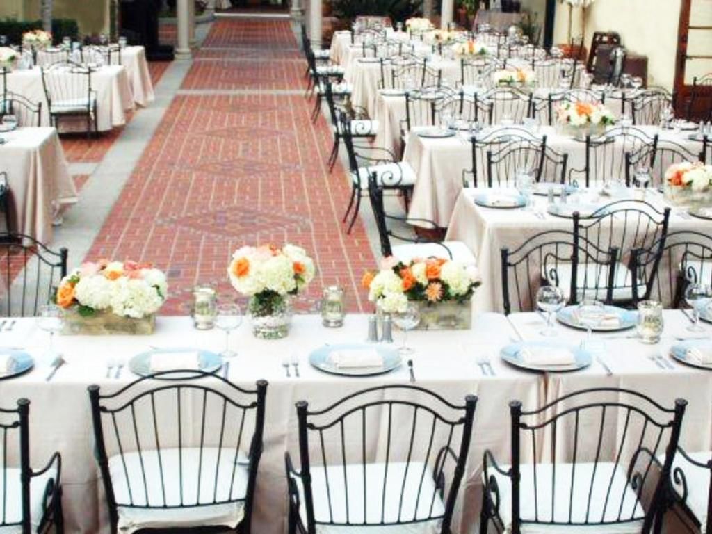 Meeting tables arranged with black chairs in Catalina Island Country Club at Hotel Atwater