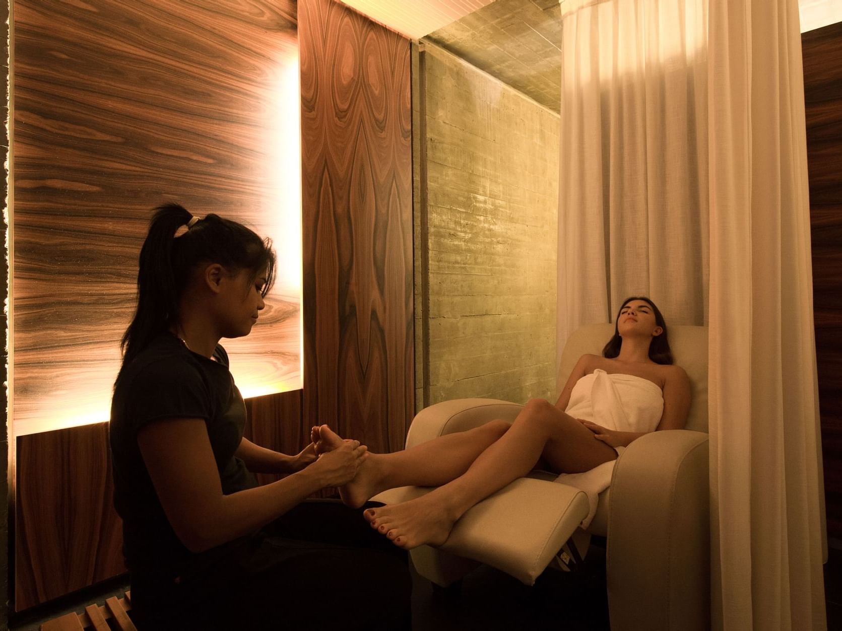 Lady enjoying massage, Oriental Spa, Duparc Contemporary Suites