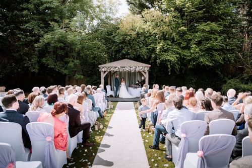 Outdoor wedding function in gazebo at Bridgewood Manor Hotel