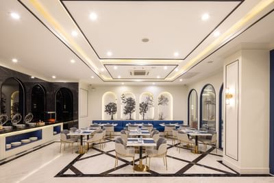 Elegant dining tables arranged in Silk Road Restaurant at Eastin Vientiane Laos