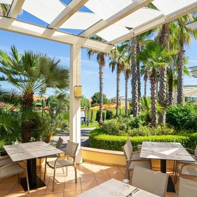 Dining area in Il Giardino & garden at Falkensteiner Hotels