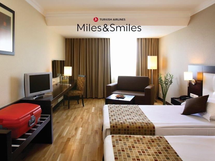 Bed & furniture in a guest room at Eresin Hotels Express 