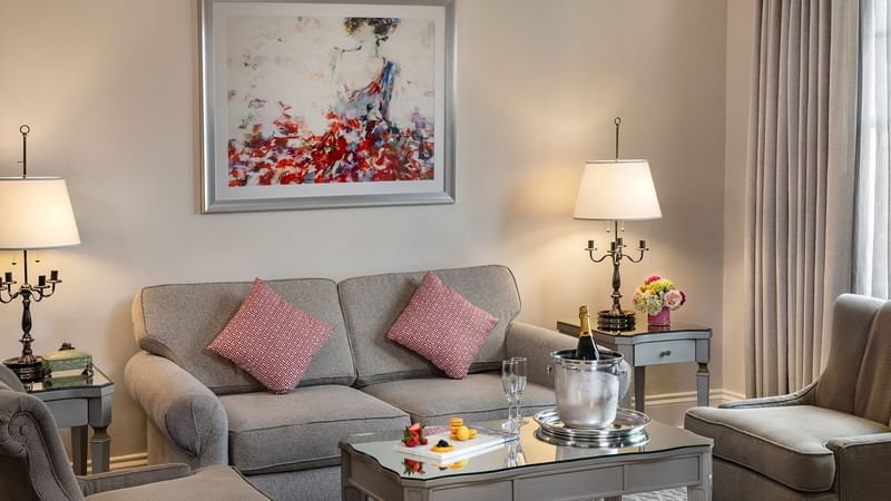 The living room of the Deluxe Suite at Warwick Melrose Dallas