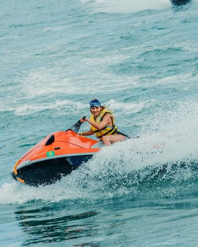 Lady enjoying a jet ski ride on the Beach near Playa Blanca Beach Resort