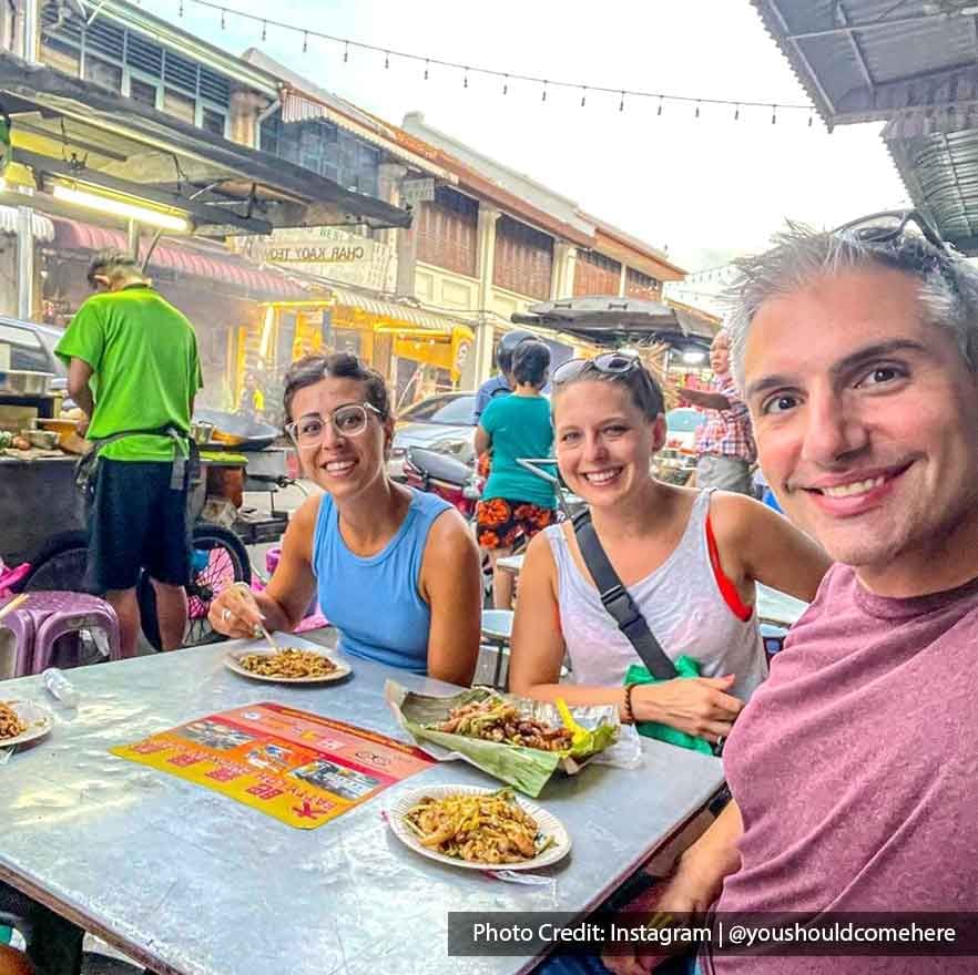 Four tourists were enjoying Char Koay Teow in Penang - Lexis Suites Penang